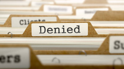 Denied Concept with Word on Folder.