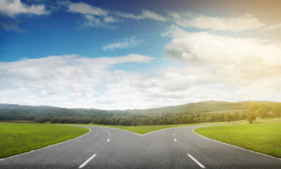 Natural landscape image of forked asphalt road